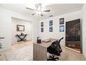 Functional home office with ample workspace, complemented by a decorative mirror and tiled flooring at 36365 Flats St, Zephyrhills, FL 33541