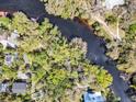 A riverfront lot surrounded by mature trees, providing privacy and natural beauty with direct access at 57 Hamilton Heath Dr Dr, Tampa, FL 33604