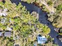 A riverfront lot with mature trees, offering a tranquil and secluded setting with water access at 57 Hamilton Heath Dr Dr, Tampa, FL 33604