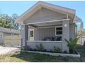 Inviting front porch featuring comfortable outdoor seating and a decorative garden at 1010 8Th S Ave, St Petersburg, FL 33705