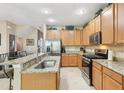 Kitchen with granite countertops, stainless appliances, and ample cabinet space at 3005 Bayshore Pointe Dr, Tampa, FL 33611