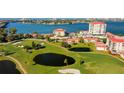 Beautiful aerial view of a well manicured golf course, luxury residences, and gorgeous waterfront views at 6265 Sun Blvd # 806, St Petersburg, FL 33715