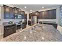 Well-equipped kitchen with granite countertops and stainless steel appliances at 10072 Sage Creek Dr, Ruskin, FL 33573