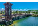 Union Park bridge over water offers a serene view with a beautiful landscape perfect for a community walk at 1571 Montgomery Bell Rd, Wesley Chapel, FL 33543