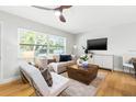 Comfortable living room with hardwood floors, stylish decor, and plenty of natural light at 1600 Connecticut Ne Ave, St Petersburg, FL 33703