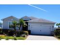 Charming single-Gathering home with a two-car garage, well-maintained landscaping, and a paved driveway at 17541 Timberline Pkwy, Punta Gorda, FL 33982