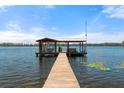 Waterfront home with a private dock and boat house extending into the lake at 20926 Ragan Ln, Land O Lakes, FL 34638