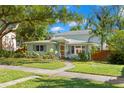 Charming two-story home with well-maintained lawn and lush landscaping in a desirable neighborhood at 2217 Brevard Ne Rd, St Petersburg, FL 33704