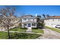Beautiful two-story home with well-maintained lawn and a charming water fountain at 5426 Venetian Ne Blvd, St Petersburg, FL 33703