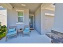 Cozy front porch with comfortable seating, offering a relaxing outdoor space to enjoy at 5523 Del Coronado Dr, Apollo Beach, FL 33572