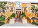 Inviting multi-level entrance with colorful stairs and well-maintained landscaping, enhancing the building's curb appeal at 100 4Th S Ave # 220, St Petersburg, FL 33701