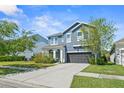 Charming two-story home featuring manicured lawn and a convenient two-car garage at 11503 Quiet Forest Dr, Tampa, FL 33635