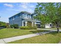 Charming two-story home featuring manicured lawn and a convenient two-car garage at 11503 Quiet Forest Dr, Tampa, FL 33635