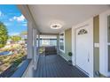 Inviting front porch with a ceiling fan and space for seating, offering a relaxing outdoor area at 1160 36Th N Ave, St Petersburg, FL 33704