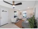 Bright living room with modern furnishings, large windows, and light wood flooring, creating a welcoming atmosphere at 1160 36Th N Ave, St Petersburg, FL 33704