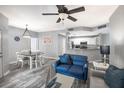 Open-concept living and dining area with neutral tones and modern decor at 1226 S Missouri Ave # 1013, Clearwater, FL 33756
