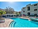 Community pool featuring poolside cabanas and a pristine pool at 1226 S Missouri Ave # 1013, Clearwater, FL 33756