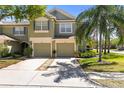 Inviting two-story home with a two-car garage and a beautifully landscaped front yard at 2759 Conch Hollow Dr, Brandon, FL 33511