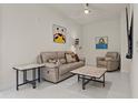 Cozy living room featuring a comfortable seating area, ceiling fan, and stylish decor at 301 1St S St # 3207, St Petersburg, FL 33701
