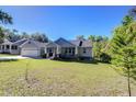 Charming home with an attached garage and inviting front porch at 37362 Dixie Ave, Dade City, FL 33525