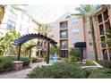 Elegant courtyard view with a central fountain and stylish pergolas at 4221 W Spruce St # 2205, Tampa, FL 33607