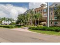 Stunning building exterior with vibrant landscaping and a circular driveway at 4221 W Spruce St # 2205, Tampa, FL 33607