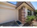 Inviting front entrance with a stylish door, adjacent to the garage, creating a welcoming feel at 8445 Calais N, Pinellas Park, FL 33781