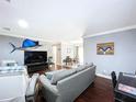 Cozy living room with hardwood floors and stylish decor, including a large sailfish wall mount at 910 Lakeside Dr, Largo, FL 33778
