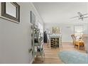 Bright dining area with a wooden table, wine rack, and coastal-themed decor at 12760 Indian Rocks Rd # 571, Largo, FL 33774