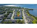 Waterfront townhomes in an aerial view, showcasing the community's layout and design at 1010 Mango Ct, Oldsmar, FL 34677