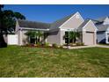 Attractive single-Gathering home with a well-maintained lawn, fenced yard, and a two-car garage at 12140 74Th St, Largo, FL 33773