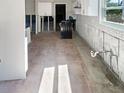 View of a kitchen featuring tile floors and updated white cabinets at 1715 Delaware Ne Ave, St Petersburg, FL 33703