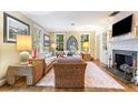 Bright living room boasts hardwood floors, neutral walls, and comfortable seating for relaxation at 2624 W Prospect Rd, Tampa, FL 33629