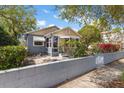 Landscaped front yard with a cozy, well-maintained exterior and a stone patio area at 3726 Prescott N St, St Petersburg, FL 33713