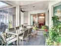 Cozy outdoor patio with dining set, ideal for relaxing and entertaining amidst lush greenery at 4262 Larkenheath Dr, Spring Hill, FL 34609