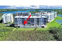 Rear aerial view showcasing the condos and highlighting private outdoor patio with waterfront views at 6495 Shoreline Dr # 8105, Seminole, FL 33708