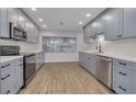 Renovated kitchen with gray cabinetry, stainless steel appliances, and modern countertops at 6672 56Th N Ave, St Petersburg, FL 33709