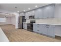 Stylish kitchen showcasing gray cabinets, stainless steel appliances, and modern countertops at 6672 56Th N Ave, St Petersburg, FL 33709