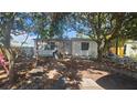 Cozy single-story home featuring a well-lit entryway and a compact front yard at 714 Gray S St, Gulfport, FL 33707