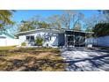 Charming single-story home featuring a freshly painted exterior and well-maintained landscaping at 813 Helena Dr, Largo, FL 33770