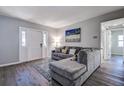 Inviting living room with a comfortable sectional sofa, stylish rug, and neutral decor at 813 Helena Dr, Largo, FL 33770