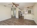 Inviting living room showcasing wood flooring and an open layout at 8423 Jackson Springs Rd, Tampa, FL 33615