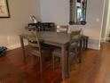 Dining room boasts hardwood floors, and a gray dining set with seating for four at 111 N 12Th St # 1426, Tampa, FL 33602