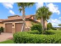 Exterior view showcasing the well-maintained landscaping and architecture at 13823 Messina Loop # 204, Bradenton, FL 34211