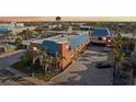Wide aerial view of the building showing its unique architectural details, blue roof, and surrounding neighborhood at 17035 Gulf Blvd # 202, North Redington Beach, FL 33708