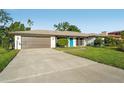 Charming home with a well-kept lawn, inviting facade, and spacious driveway at 4065 38Th S St, St Petersburg, FL 33711