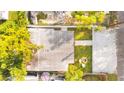 Aerial shot of a home with a yard featuring a patio with fire pit and outdoor seating at 4803 N 9Th St, Tampa, FL 33603