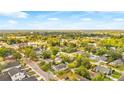This aerial view showcases a neighborhood with mature trees and a mix of residential homes at 4803 N 9Th St, Tampa, FL 33603