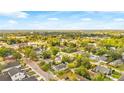 This aerial view showcases a neighborhood with mature trees and a mix of residential homes at 4803 N 9Th St, Tampa, FL 33603