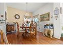 Formal dining room with hardwood floors, chandelier and traditional decor at 5167 Sterling Manor Dr, Tampa, FL 33647